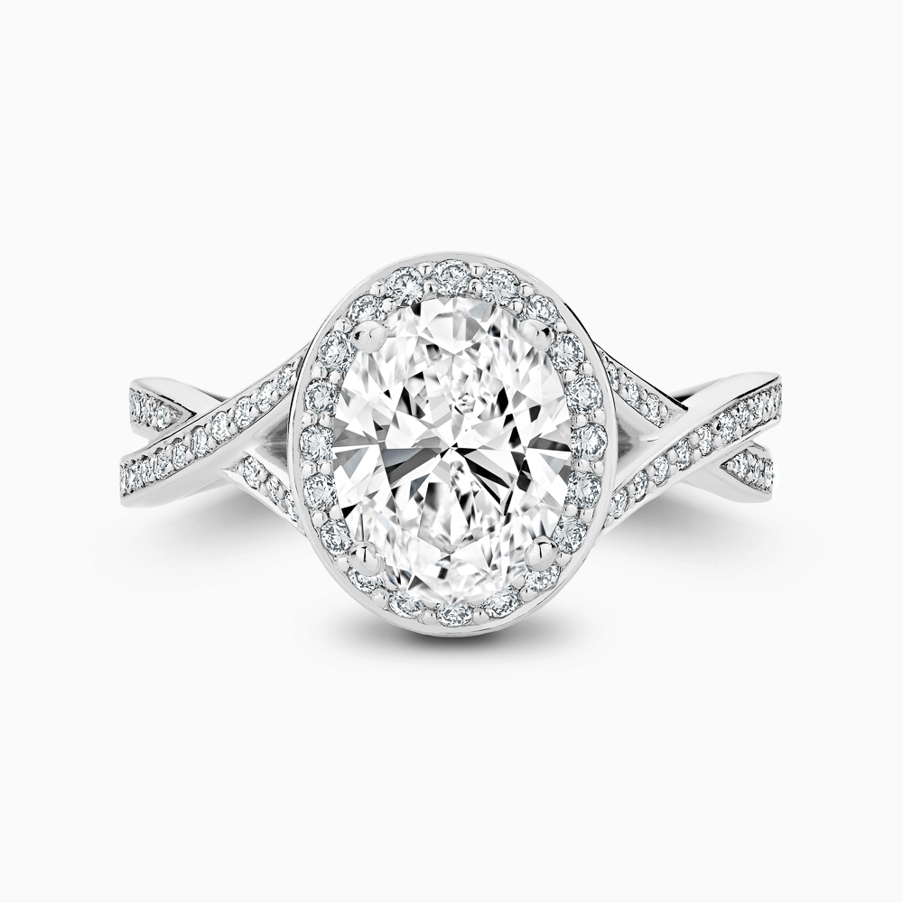 The Ecksand Twisted Split Shank Diamond Engagement Ring with Diamond Halo shown with Oval in 18k White Gold