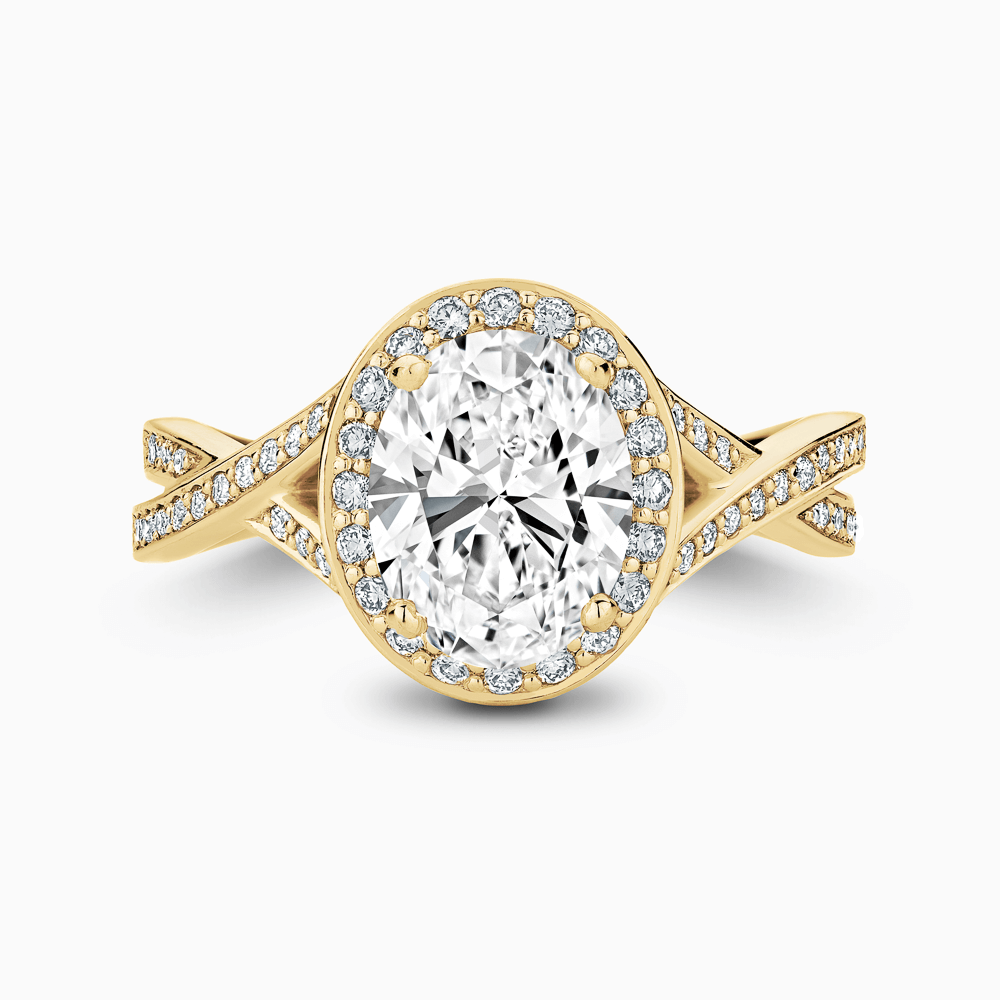 The Ecksand Twisted Split Shank Diamond Engagement Ring with Diamond Halo shown with Oval in 18k Yellow Gold