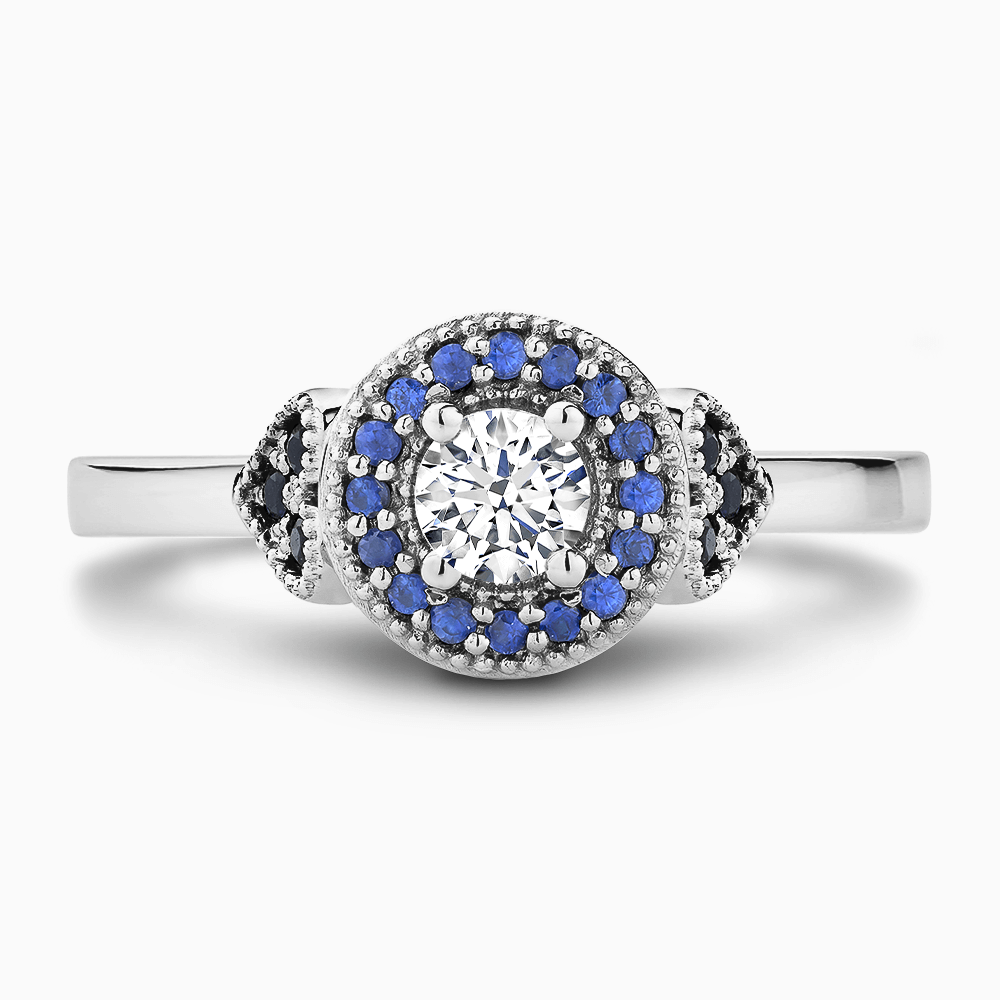 The Ecksand Diamond Engagement Ring with Blue Sapphire Halo and Side Stones shown with Round in 18k White Gold