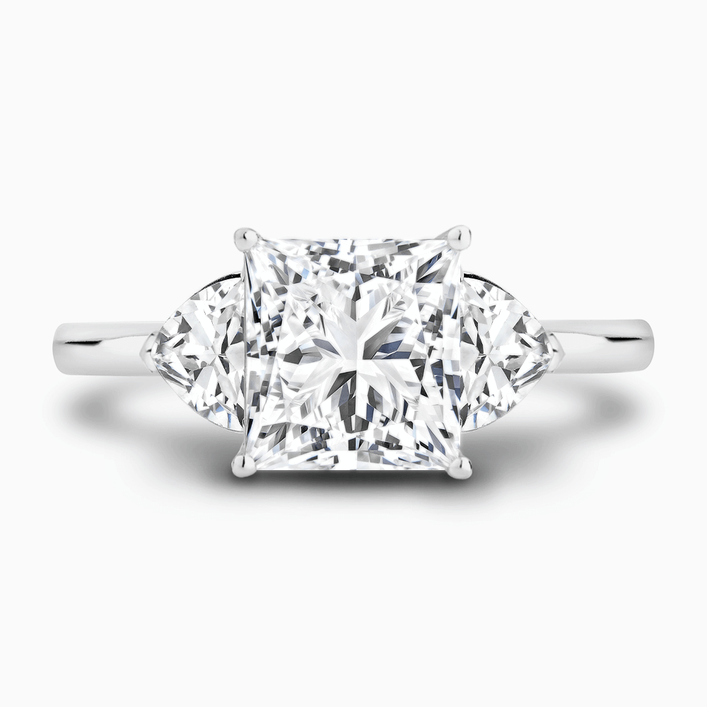 The Ecksand Three-Stone Diamond Engagement Ring with Trillion-Cut Side Diamonds shown with Princess in 18k White Gold