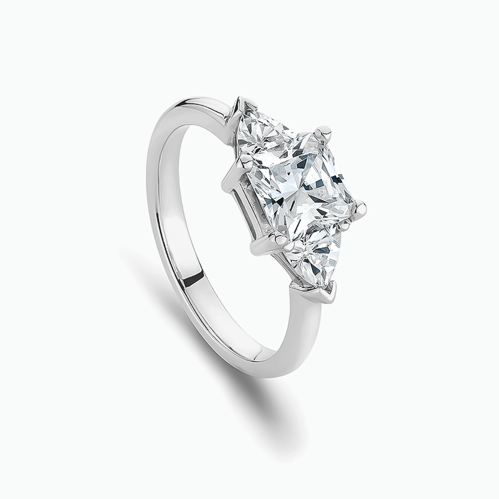 The Ecksand Three-Stone Diamond Engagement Ring with Trillion-Cut Side Diamonds shown with  in 