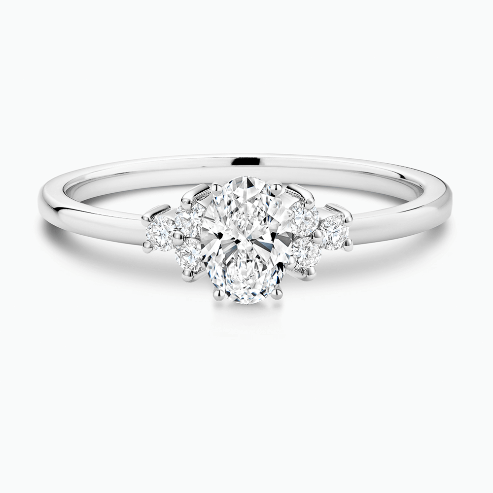 The Ecksand Iconic Diamond Engagement Ring with Six Side Diamonds shown with Oval in 18k White Gold