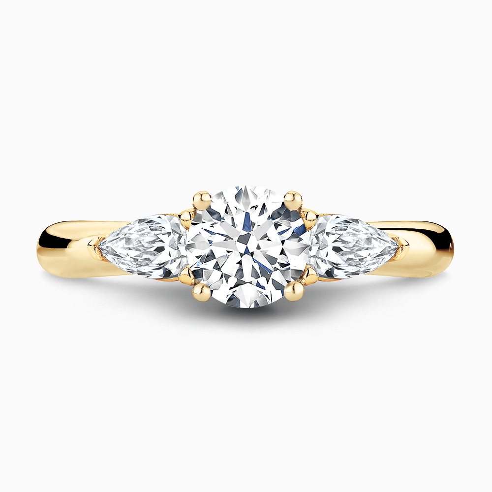 The Ecksand Iconic Three-Stone Diamond Engagement Ring with Cathedral Setting shown with Round in 18k Yellow Gold