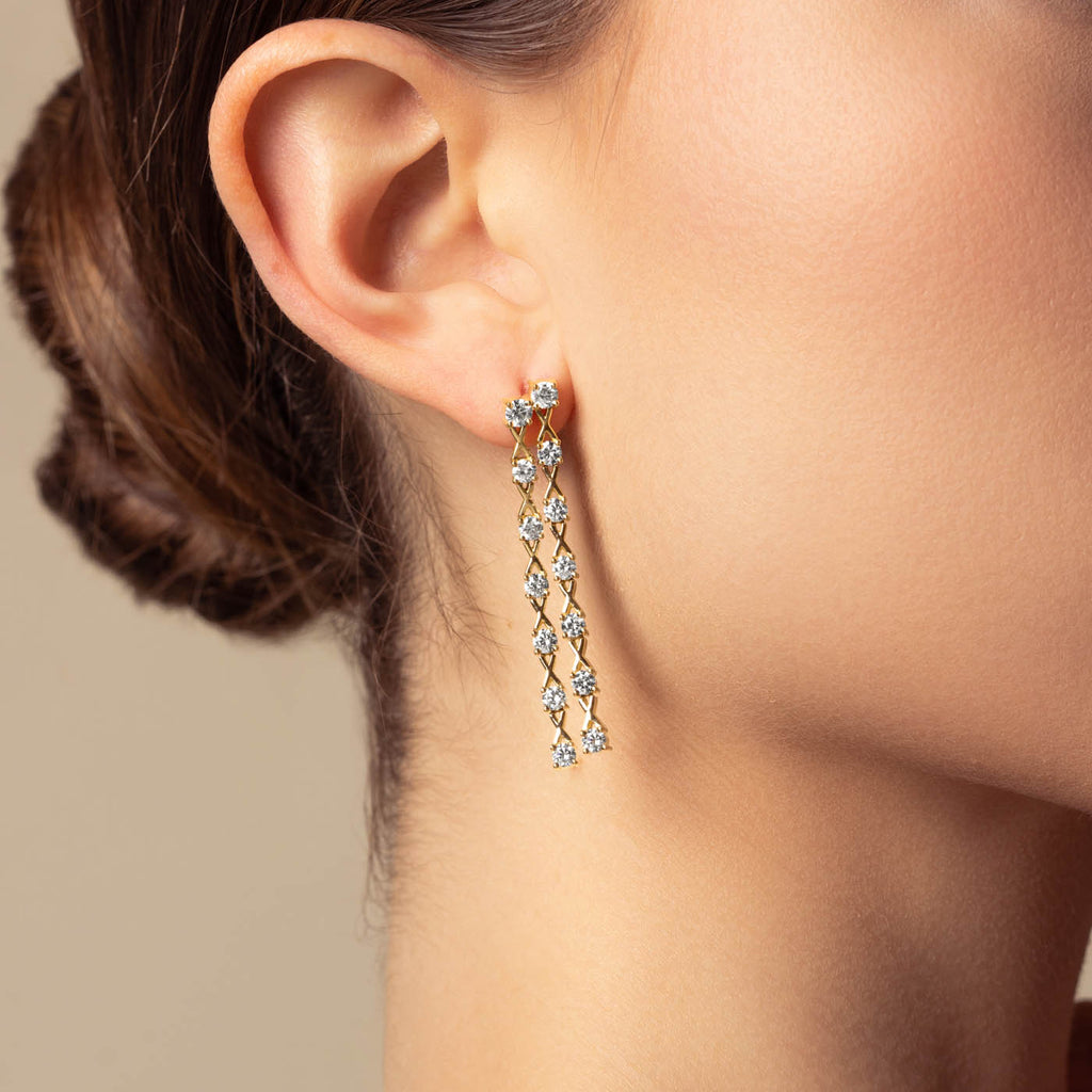 The Ecksand Interlocking X's Double Diamond Dangle Earrings shown with  in 