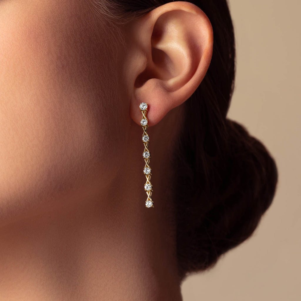 The Ecksand Interlocking X's Diamond Dangle Earrings shown with  in 