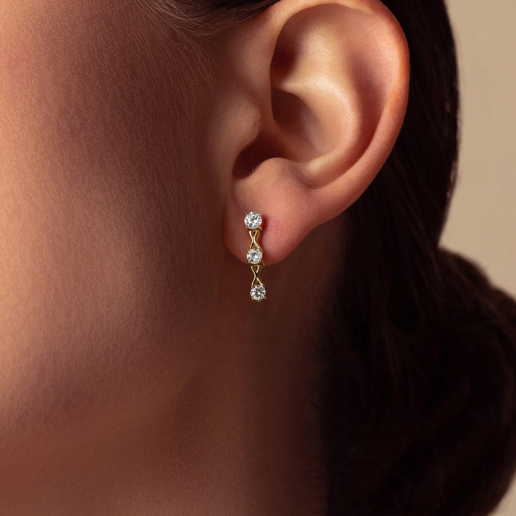The Ecksand Interlocking X's Diamond Drop Earrings shown with  in 