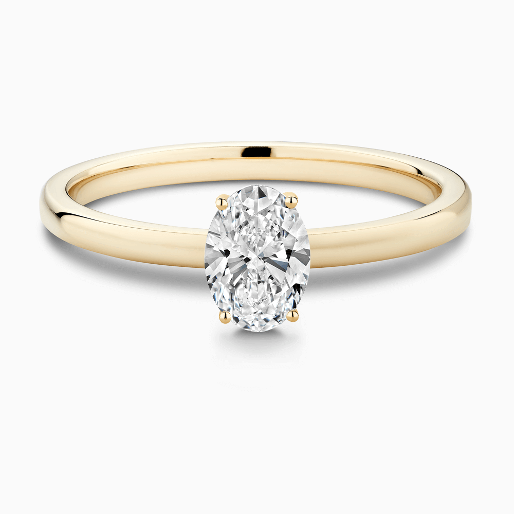 The Ecksand Solitaire Diamond Engagement Ring with Diamond Pavé Basket Setting shown with Oval in 18k Yellow Gold