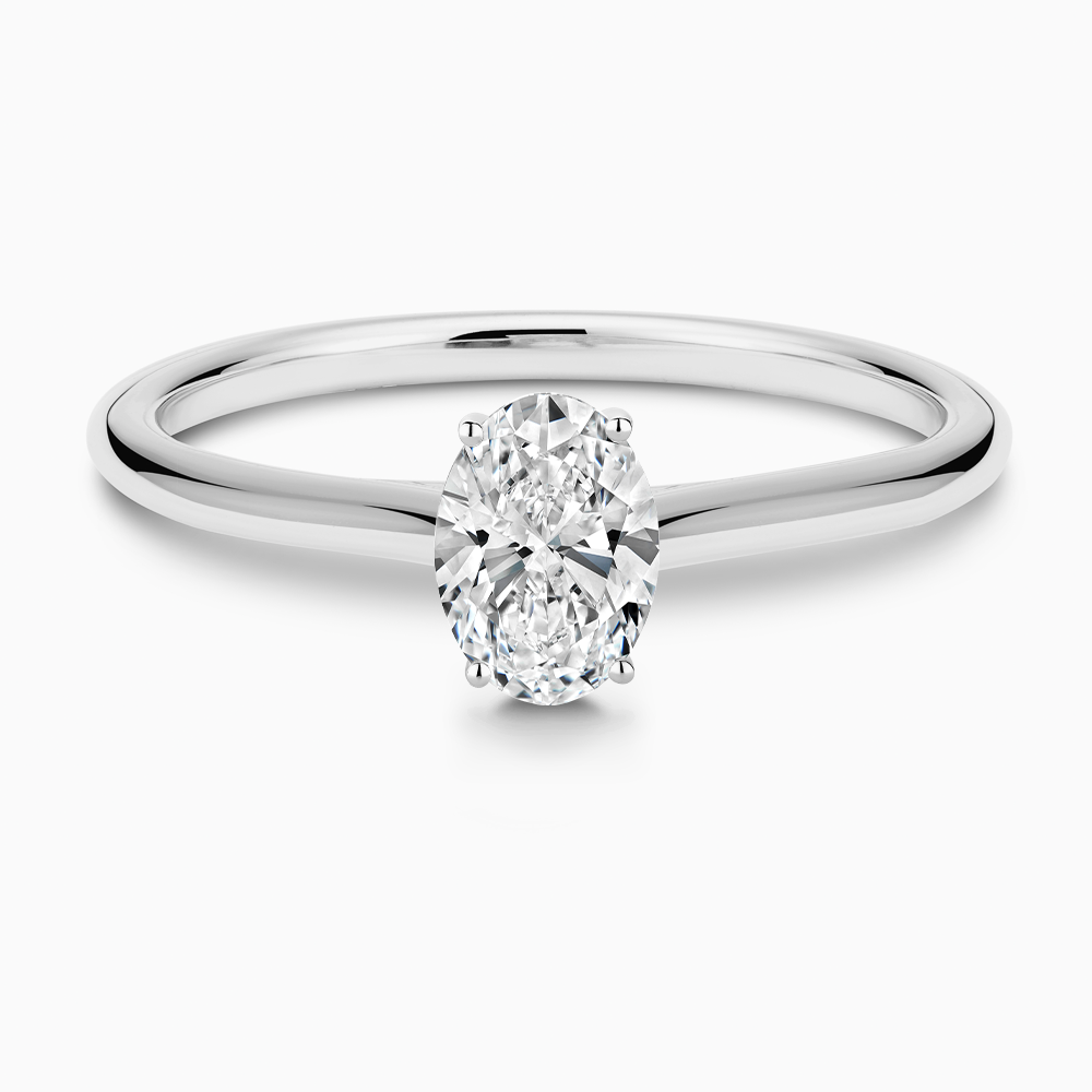 The Ecksand Thick Diamond Engagement Ring with Diamond Bridge and Cathedral Setting shown with Oval in Platinum