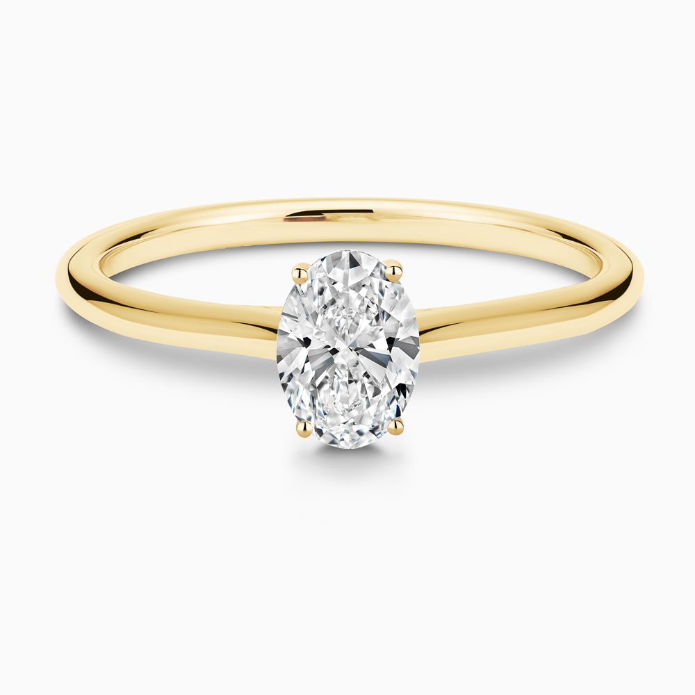 The Ecksand Thick Diamond Engagement Ring with Diamond Bridge and Cathedral Setting shown with Oval in 18k Yellow Gold