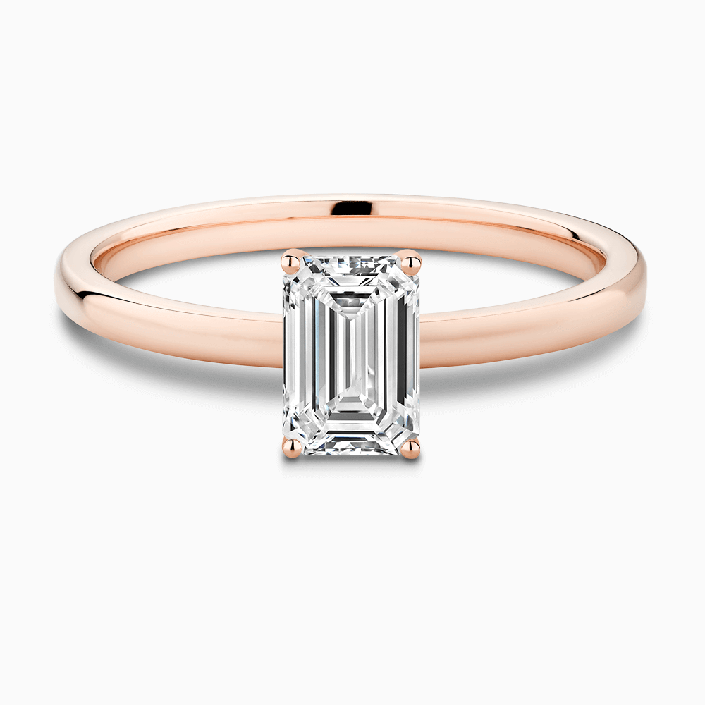 The Ecksand Solitaire Diamond Engagement Ring with Diamond Pavé Basket Setting shown with Emerald in 14k Rose Gold