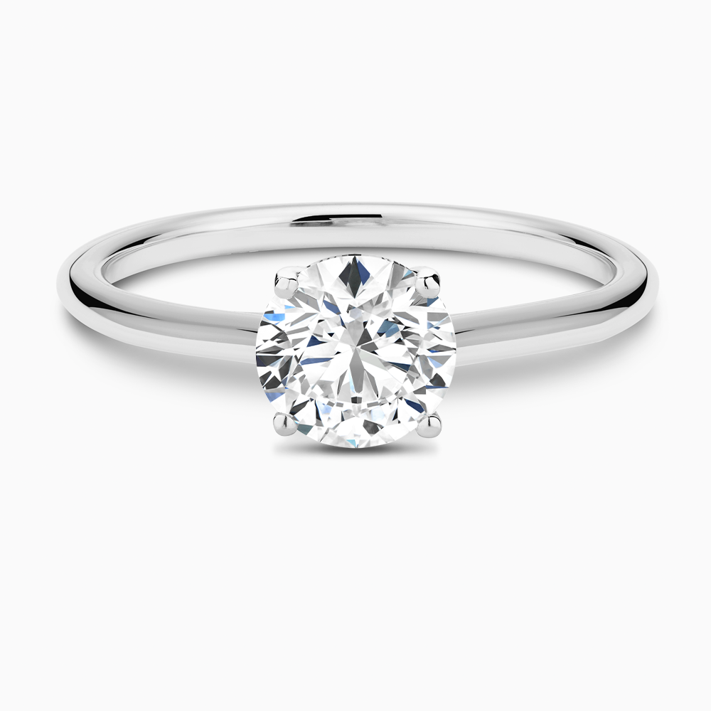 The Ecksand Iconic Diamond Engagement Ring with Diamond Bridge and Cathedral Setting shown with Round in Platinum