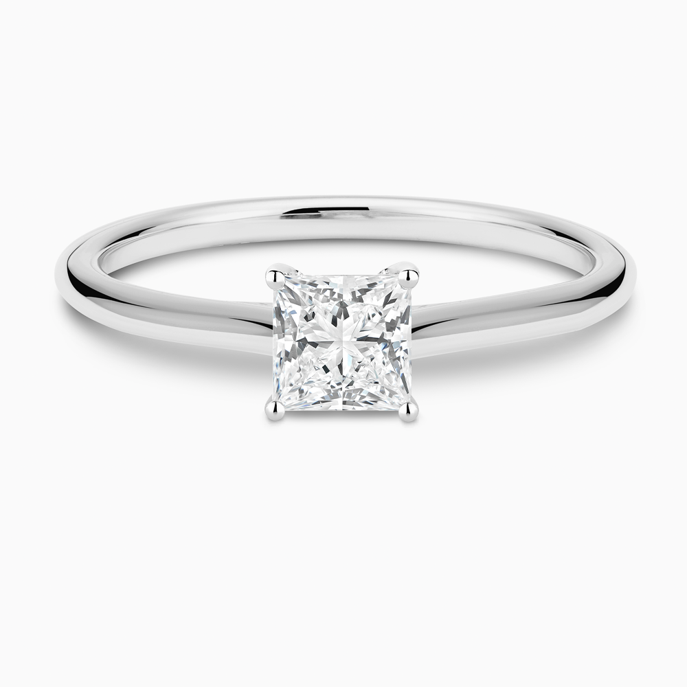 The Ecksand Iconic Diamond Engagement Ring with Diamond Bridge and Cathedral Setting shown with Princess in Platinum