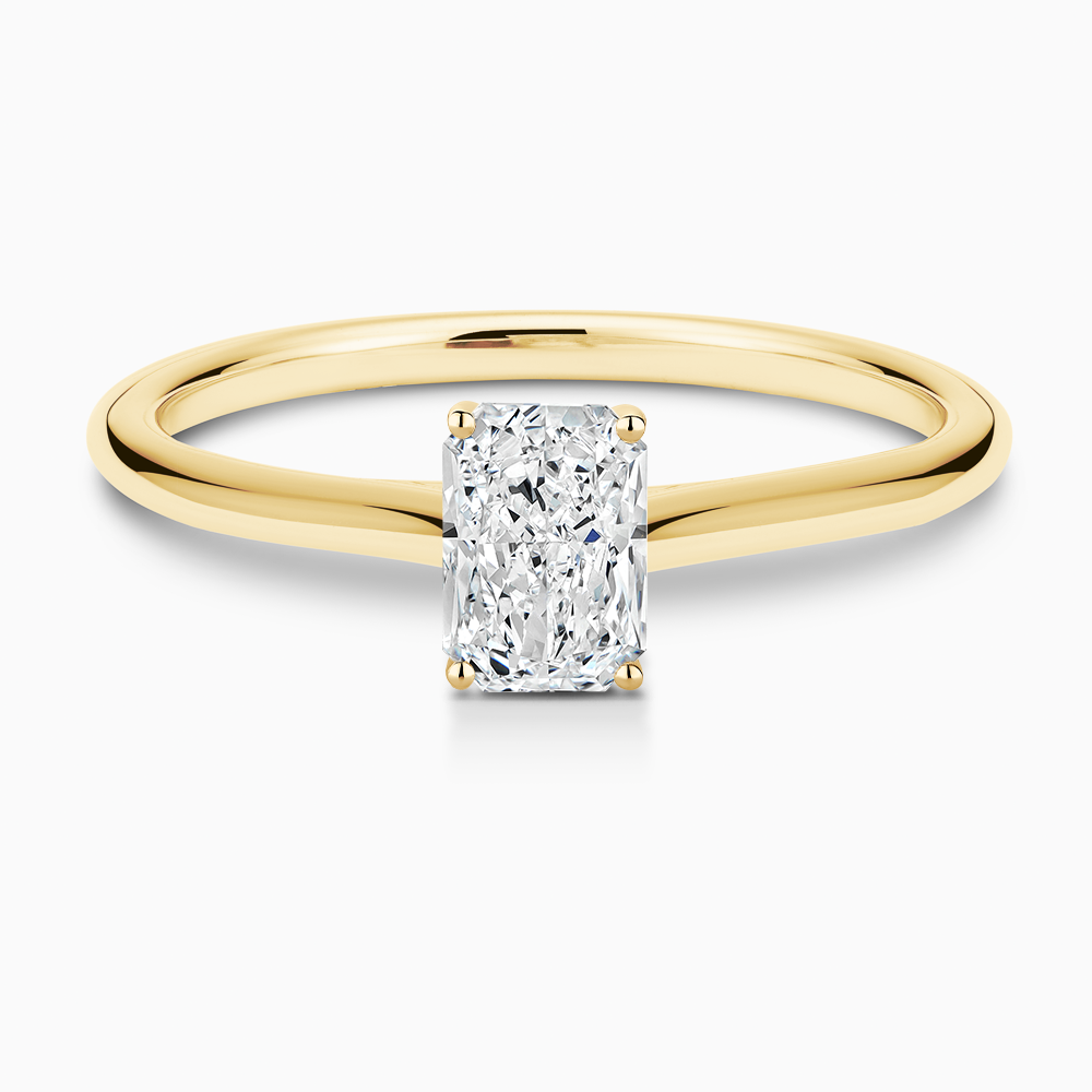 The Ecksand Iconic Diamond Engagement Ring with Diamond Bridge and Cathedral Setting shown with Radiant in 18k Yellow Gold