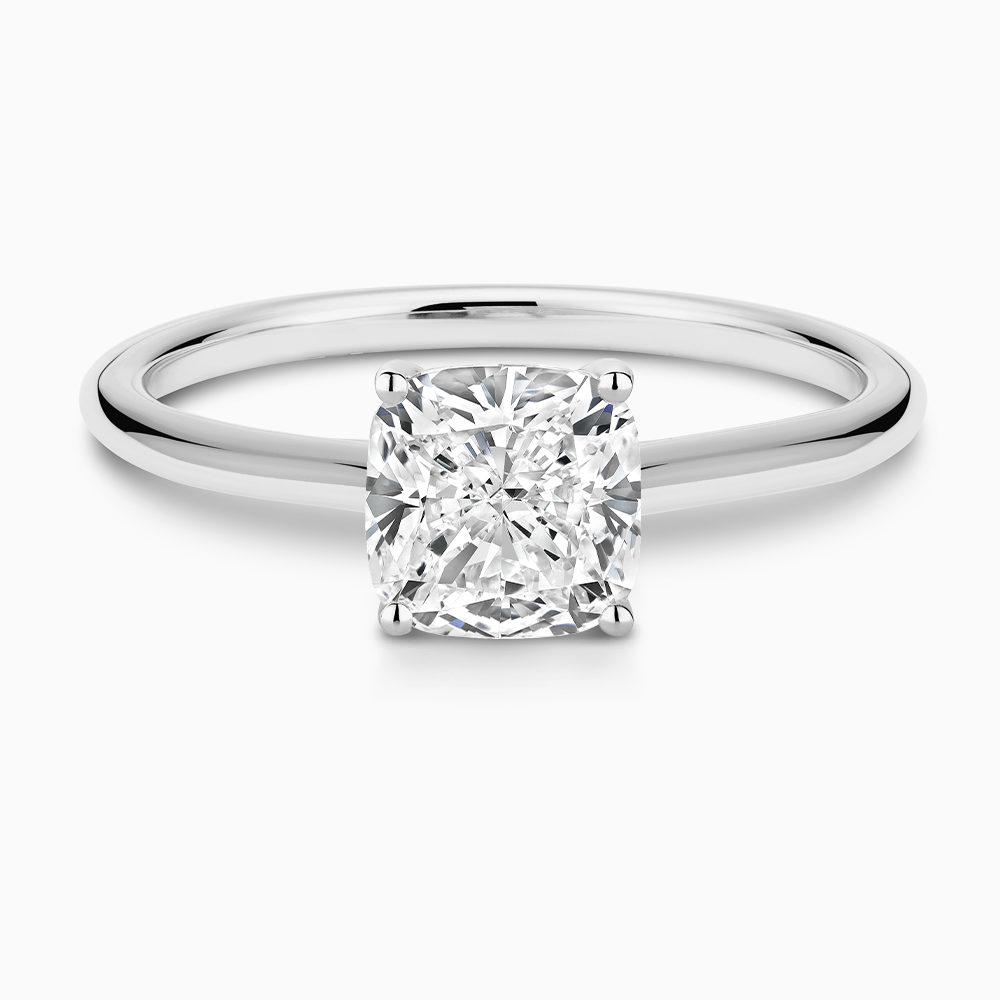 The Ecksand Iconic Diamond Engagement Ring with Diamond Bridge and Cathedral Setting shown with Cushion in 18k White Gold