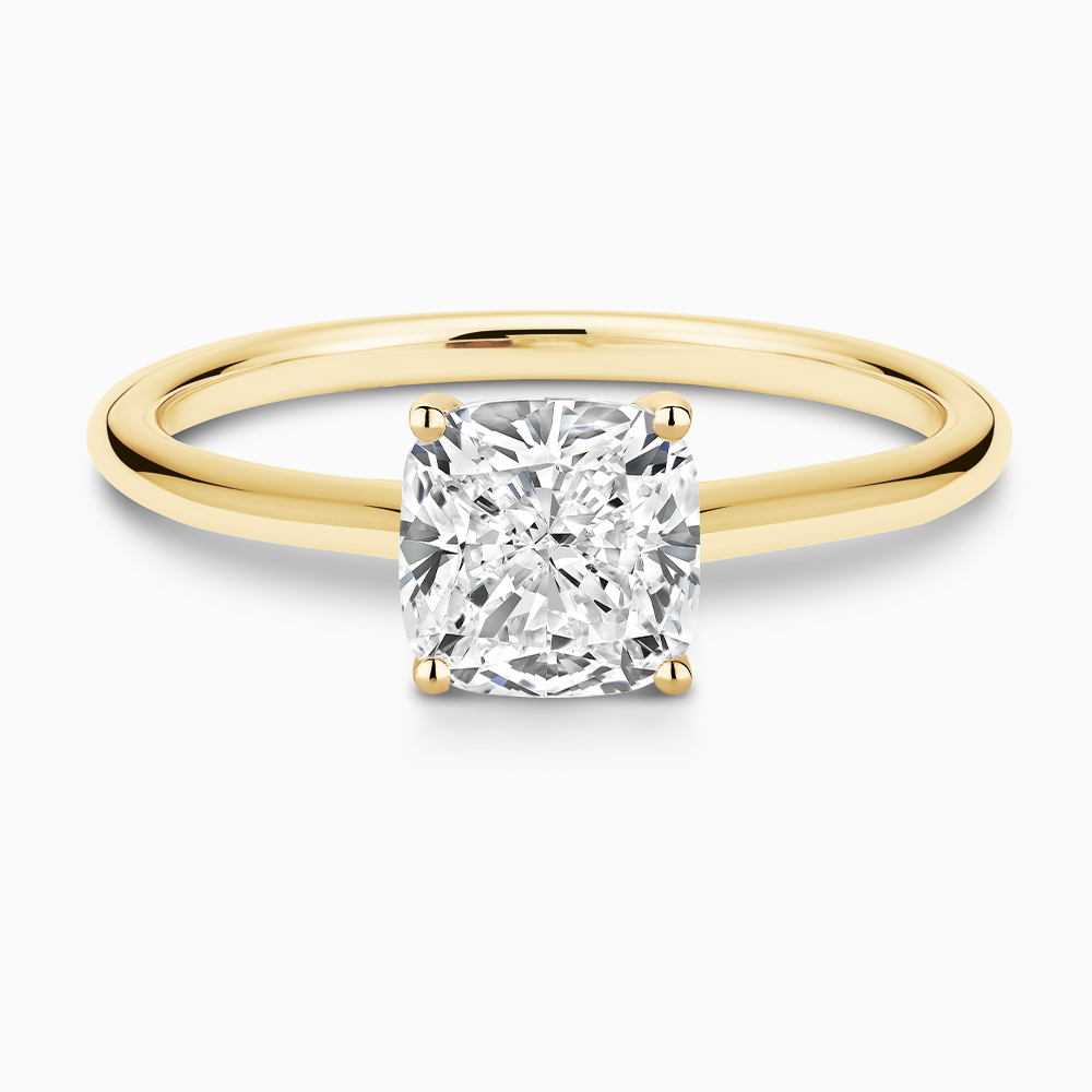 The Ecksand Iconic Diamond Engagement Ring with Diamond Bridge and Cathedral Setting shown with Cushion in 18k Yellow Gold
