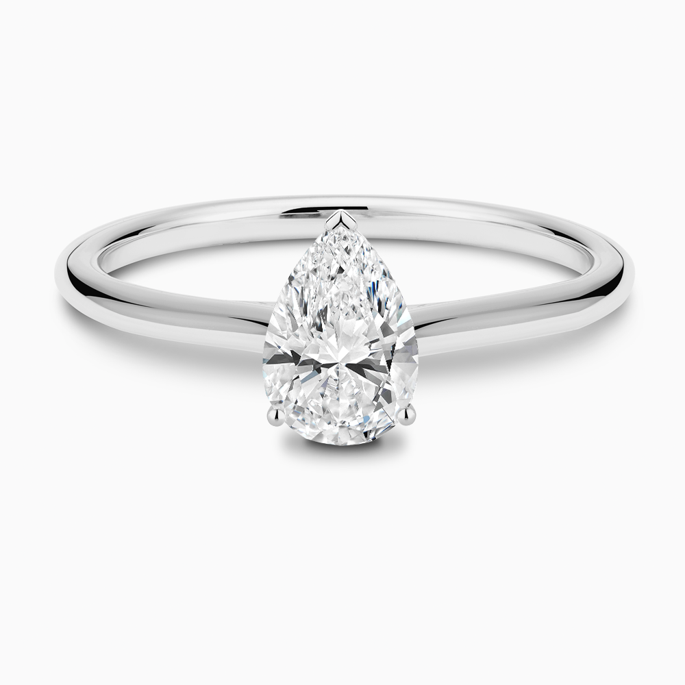 The Ecksand Iconic Diamond Engagement Ring with Diamond Bridge and Cathedral Setting shown with Pear in Platinum