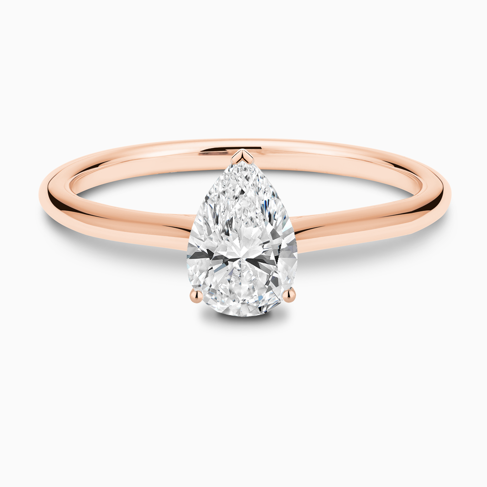 The Ecksand Iconic Diamond Engagement Ring with Diamond Bridge and Cathedral Setting shown with Pear in 14k Rose Gold