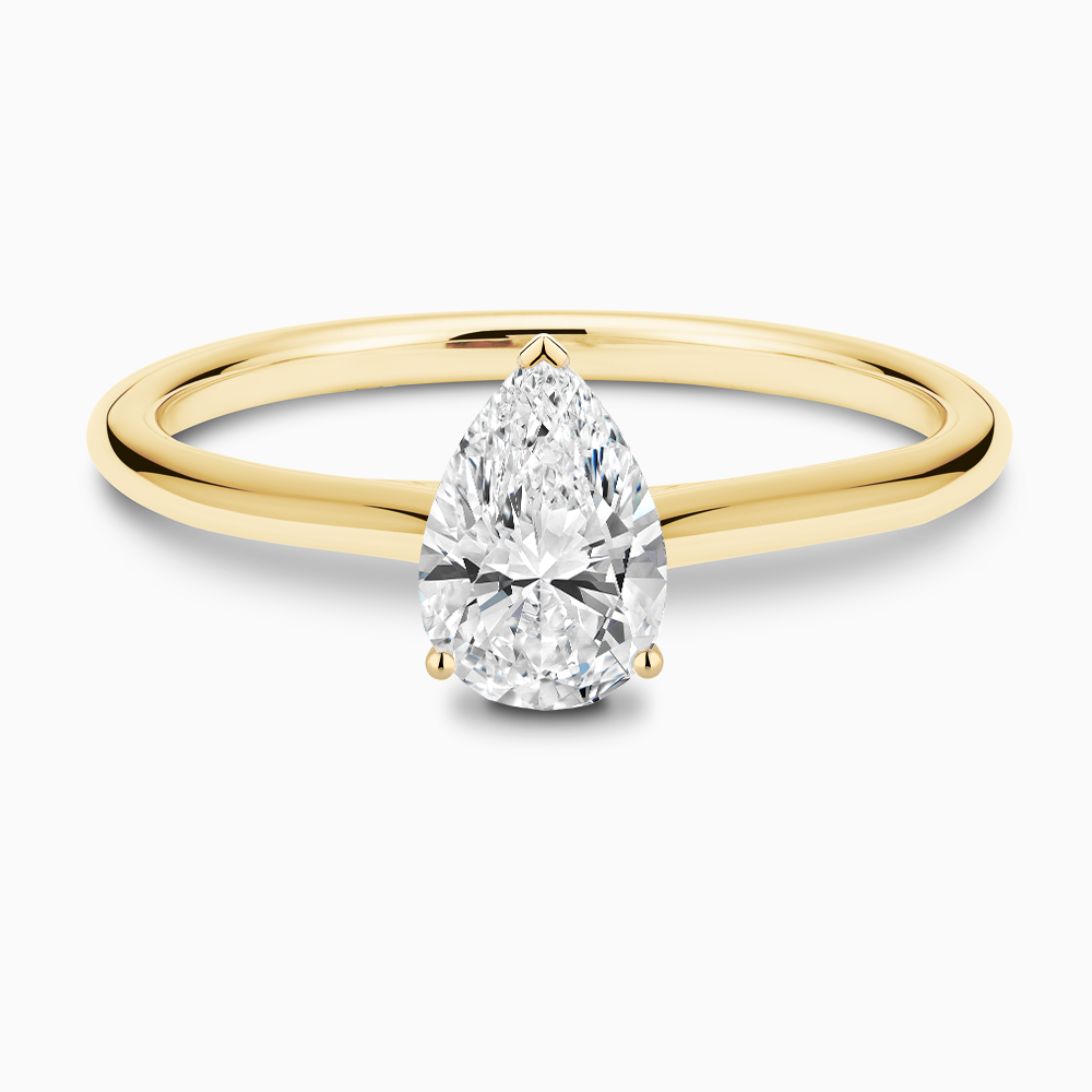 The Ecksand Iconic Diamond Engagement Ring with Diamond Bridge and Cathedral Setting shown with Pear in 18k Yellow Gold