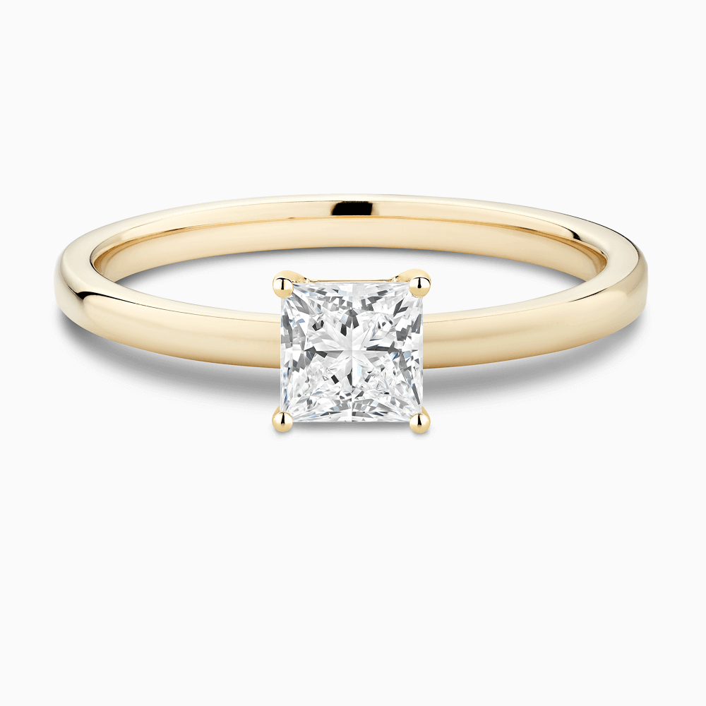 The Ecksand Solitaire Diamond Engagement Ring with Diamond Pavé Basket Setting shown with Princess in 18k Yellow Gold
