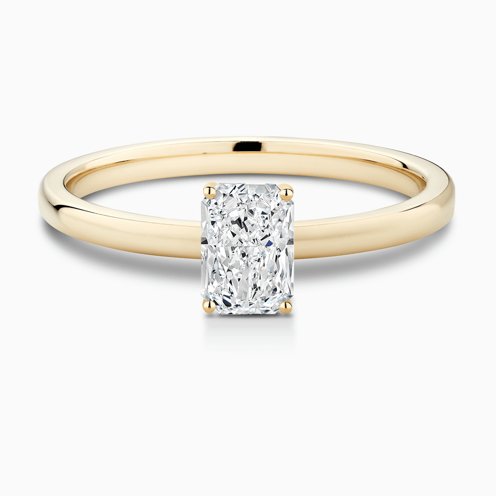 The Ecksand Solitaire Diamond Engagement Ring with Diamond Pavé Basket Setting shown with Radiant in 18k Yellow Gold
