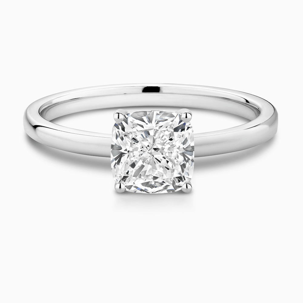The Ecksand Solitaire Diamond Engagement Ring with Diamond Pavé Basket Setting shown with Cushion in Platinum
