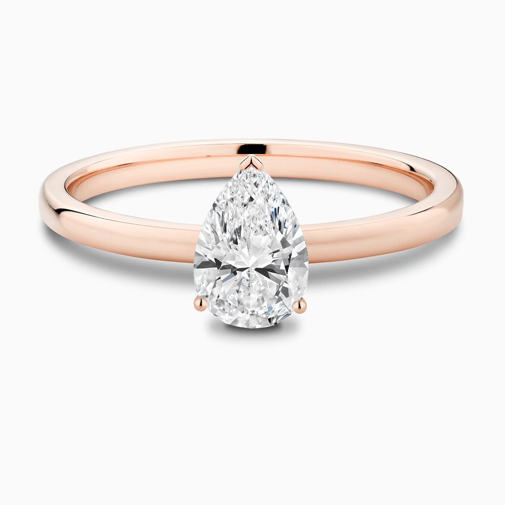 The Ecksand Solitaire Diamond Engagement Ring with Diamond Pavé Basket Setting shown with Pear in 14k Rose Gold
