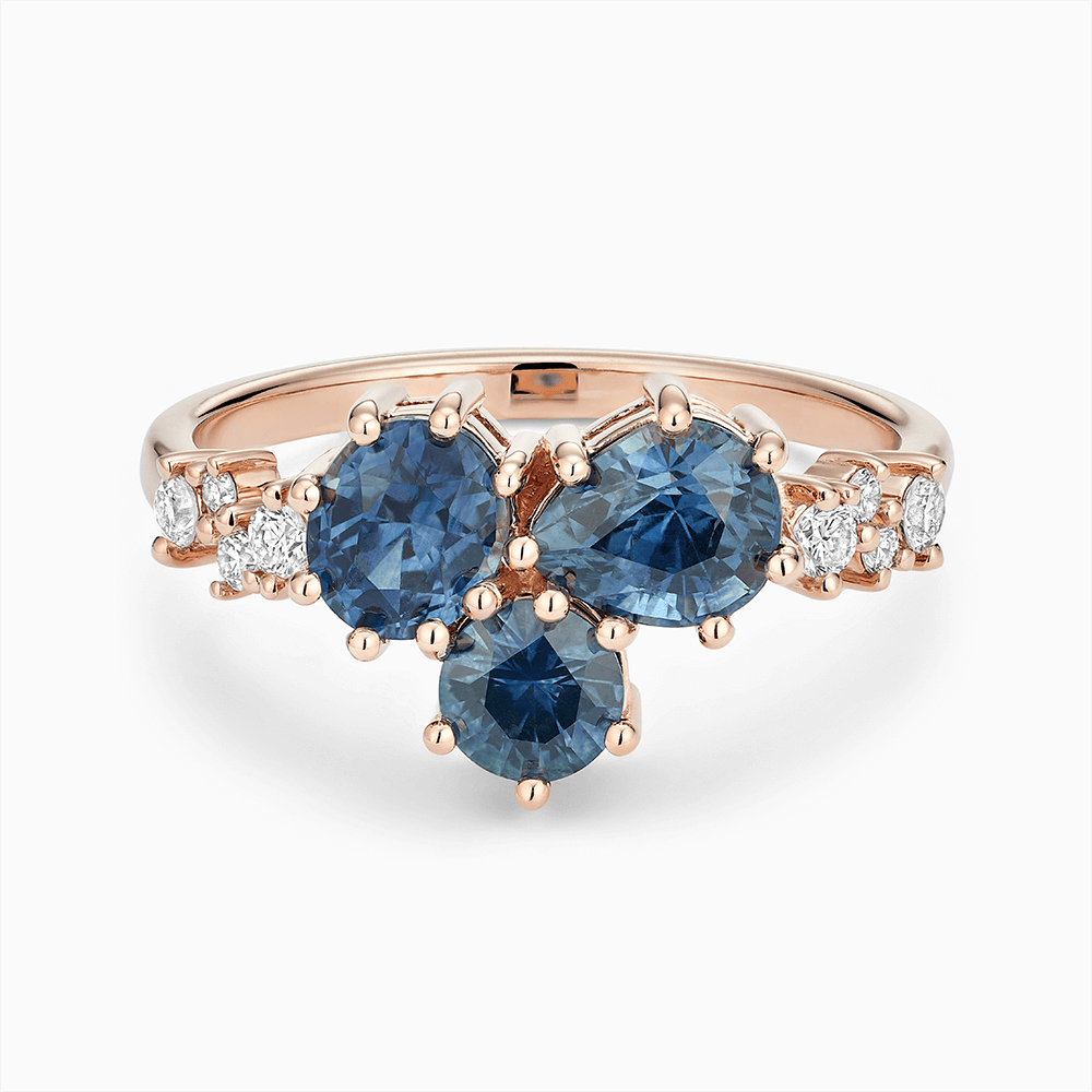 The Ecksand Montana Sapphire Cluster Engagement Ring with Side Diamonds shown with Lab-grown VS2+/ F+ in 14k Rose Gold