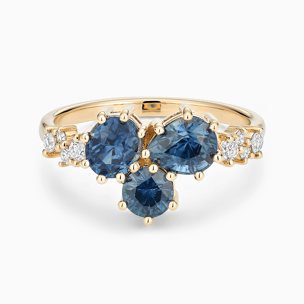 The Ecksand Montana Sapphire Cluster Engagement Ring with Side Diamonds shown with Lab-grown VS2+/ F+ in 18k Yellow Gold