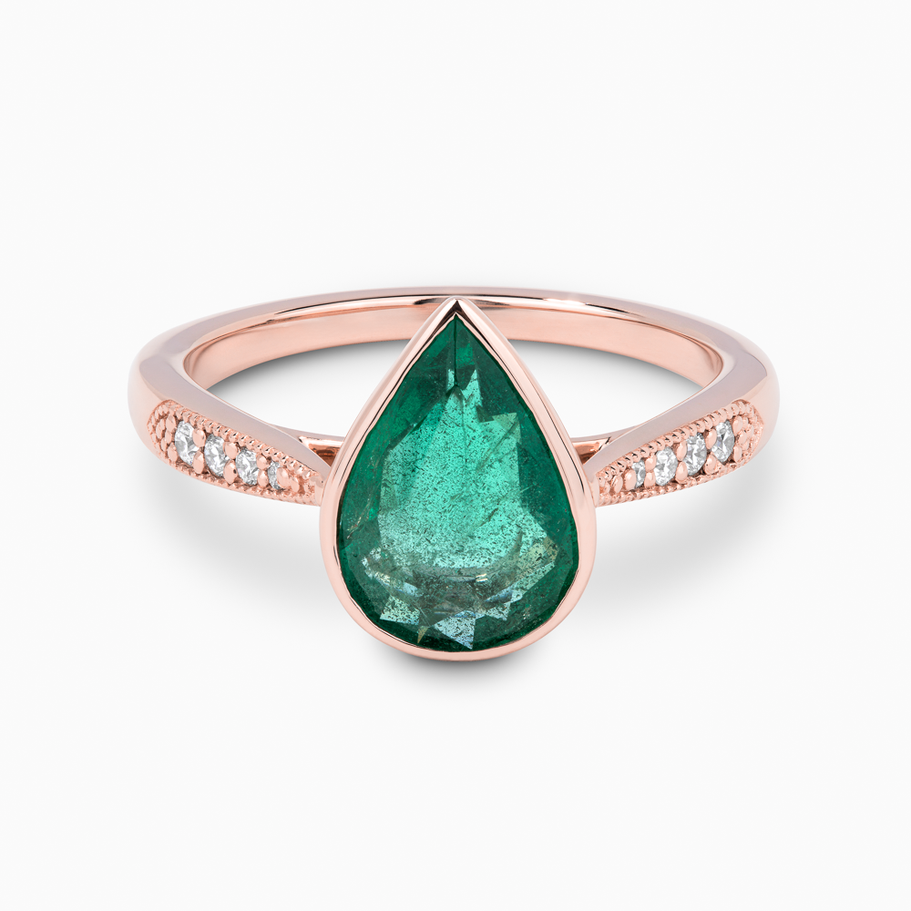 The Ecksand Emerald Engagement Ring With Tapered Diamond Band shown with  in 14k Rose Gold