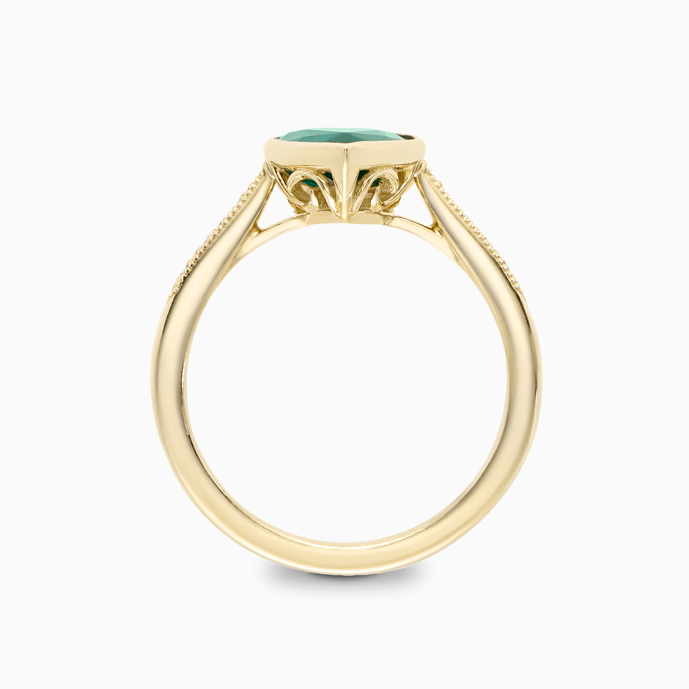 The Ecksand Emerald Engagement Ring With Tapered Diamond Band shown with  in 