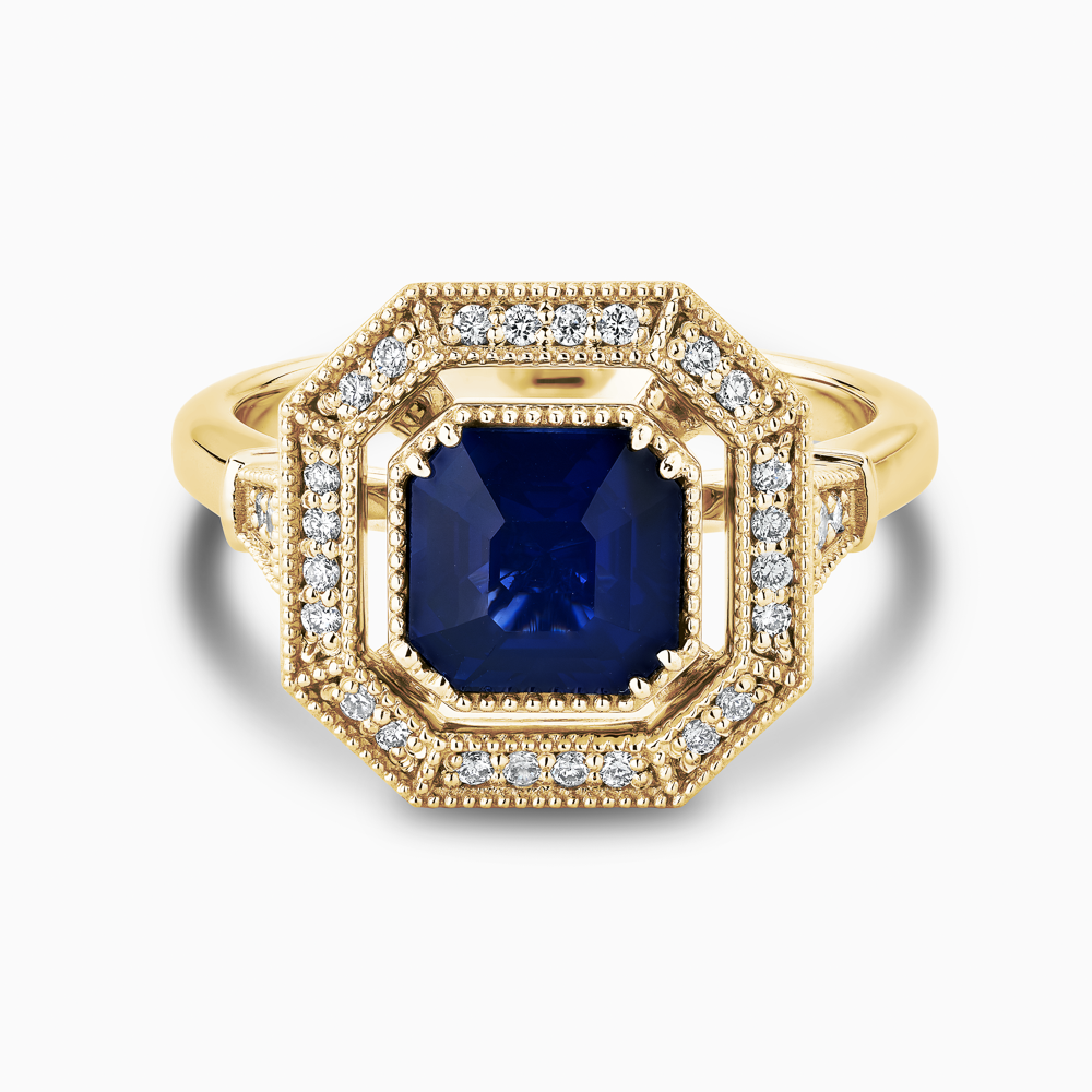 The Ecksand Art-Deco Diamond Halo Engagement Ring with Centre Blue Sapphire shown with  in 18k Yellow Gold