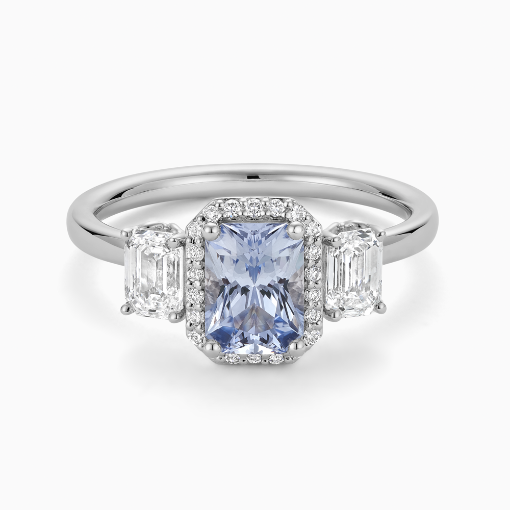 The Ecksand Three-Stone Diamond Engagement Ring with Centre Blue Sapphire shown with  in Platinum