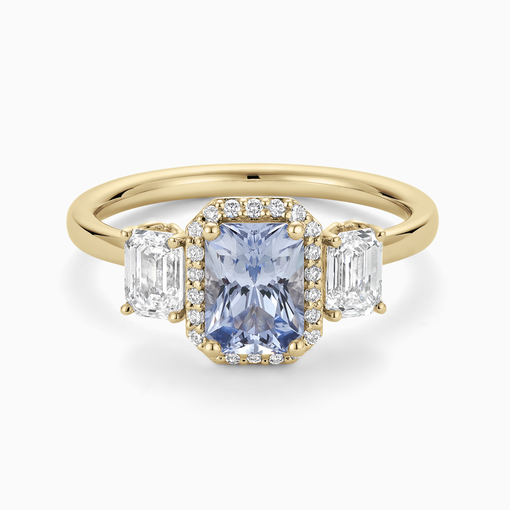 The Ecksand Three-Stone Diamond Engagement Ring with Centre Blue Sapphire shown with  in 18k Yellow Gold