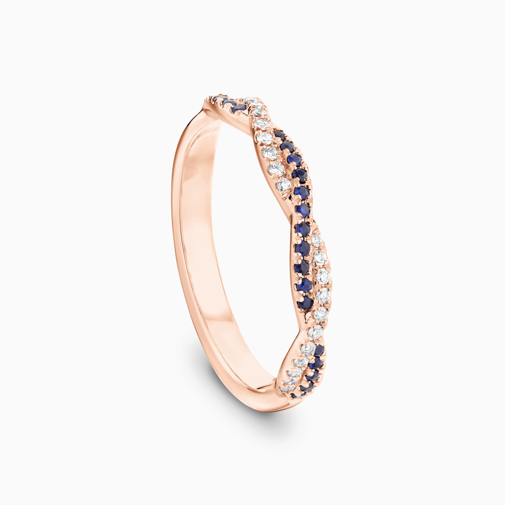 The Ecksand Twisted Wedding Ring with Accent Blue Sapphires and Diamonds shown with  in 