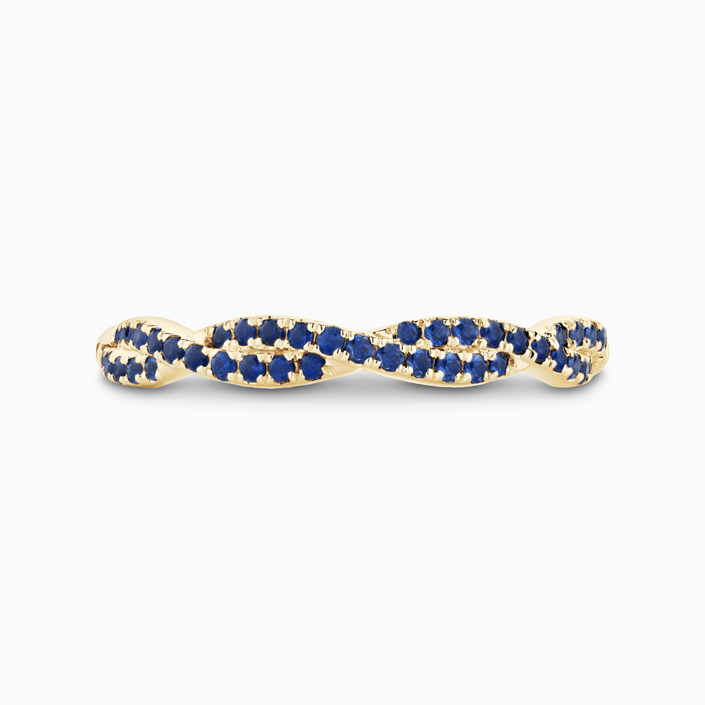 The Ecksand Twisted Eternity Ring with Blue Sapphire Pavé shown with  in 18k Yellow Gold