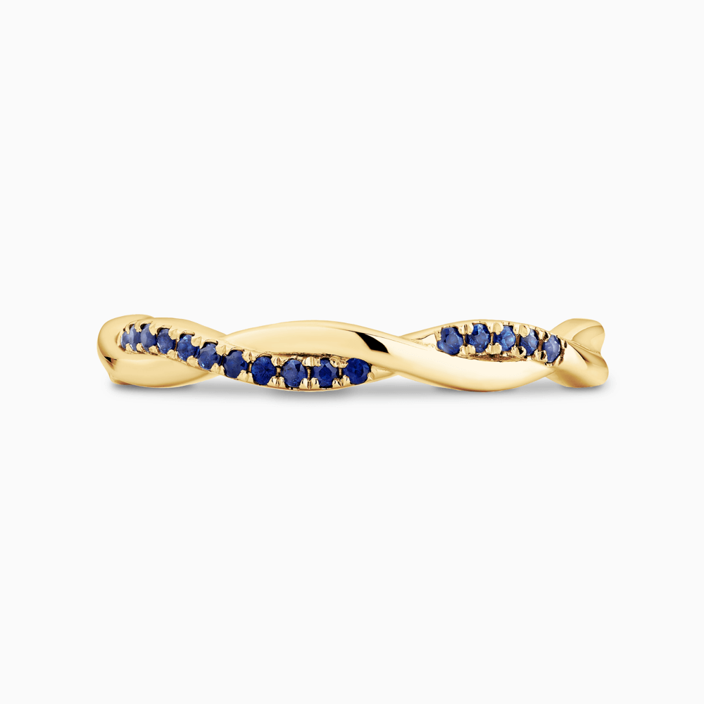 The Ecksand Twisted Eternity Ring with Accent Blue Sapphires shown with  in 18k Yellow Gold