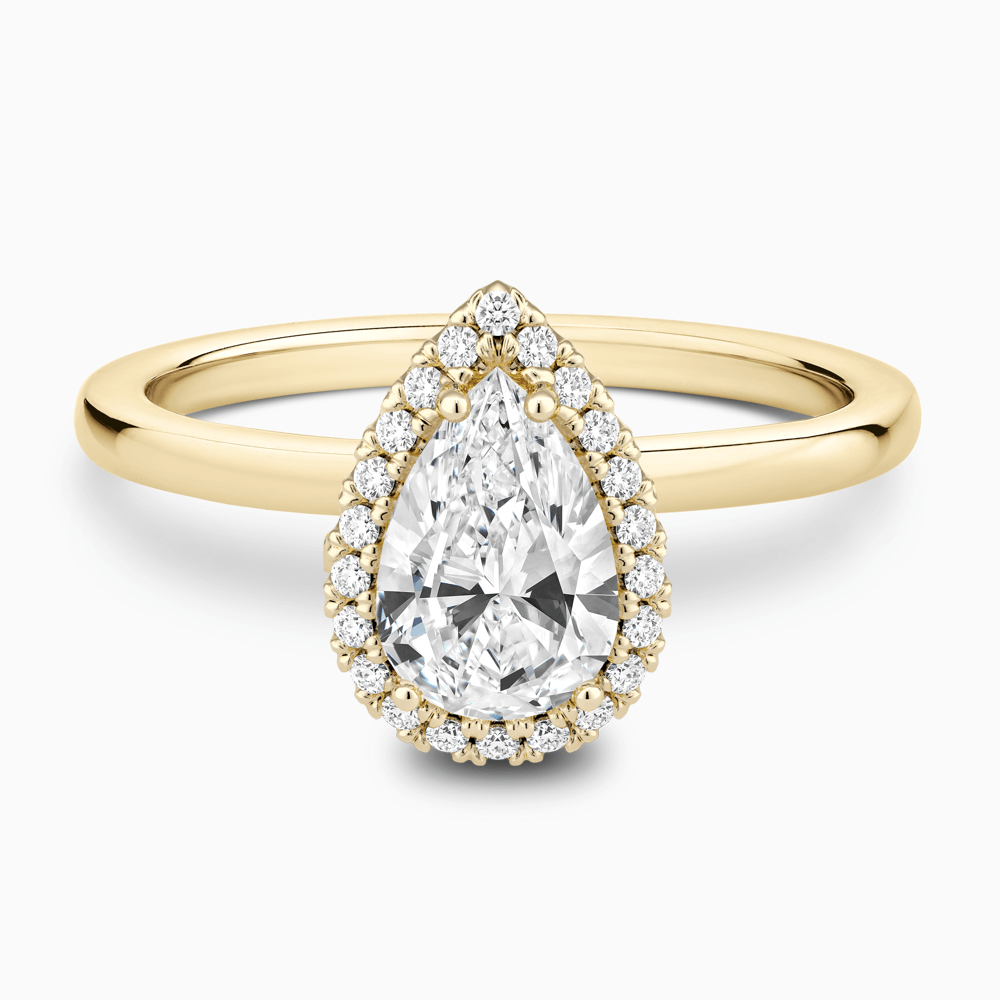 The Ecksand Iconic Diamond Halo Engagement Ring with Plain Band shown with Pear in 18k Yellow Gold