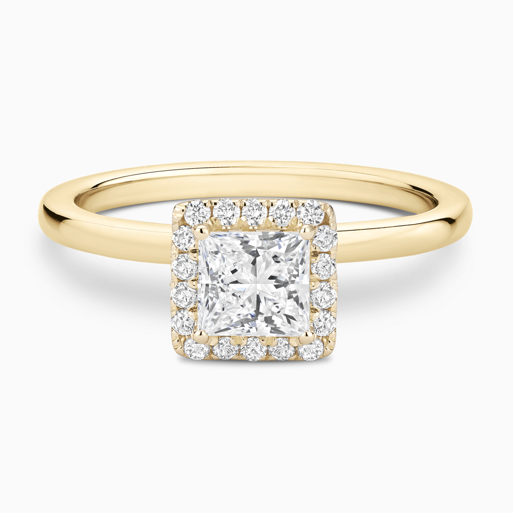 The Ecksand Iconic Diamond Halo Engagement Ring with Plain Band shown with Princess in 18k Yellow Gold