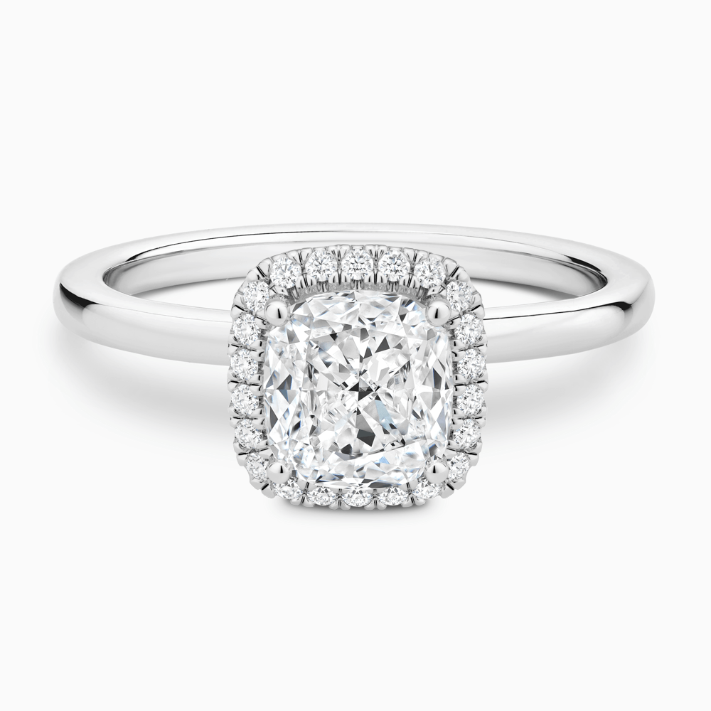 The Ecksand Iconic Diamond Halo Engagement Ring with Plain Band shown with Cushion in Platinum