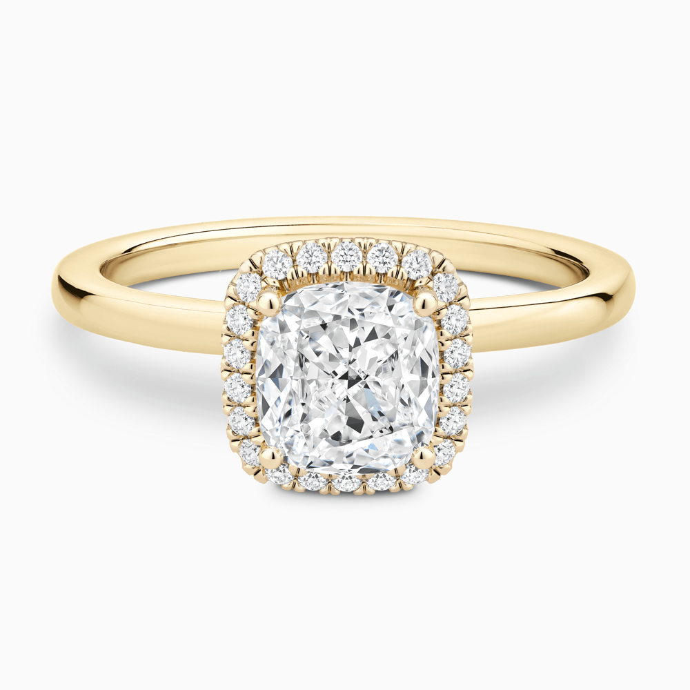 The Ecksand Iconic Diamond Halo Engagement Ring with Plain Band shown with Cushion in 18k Yellow Gold