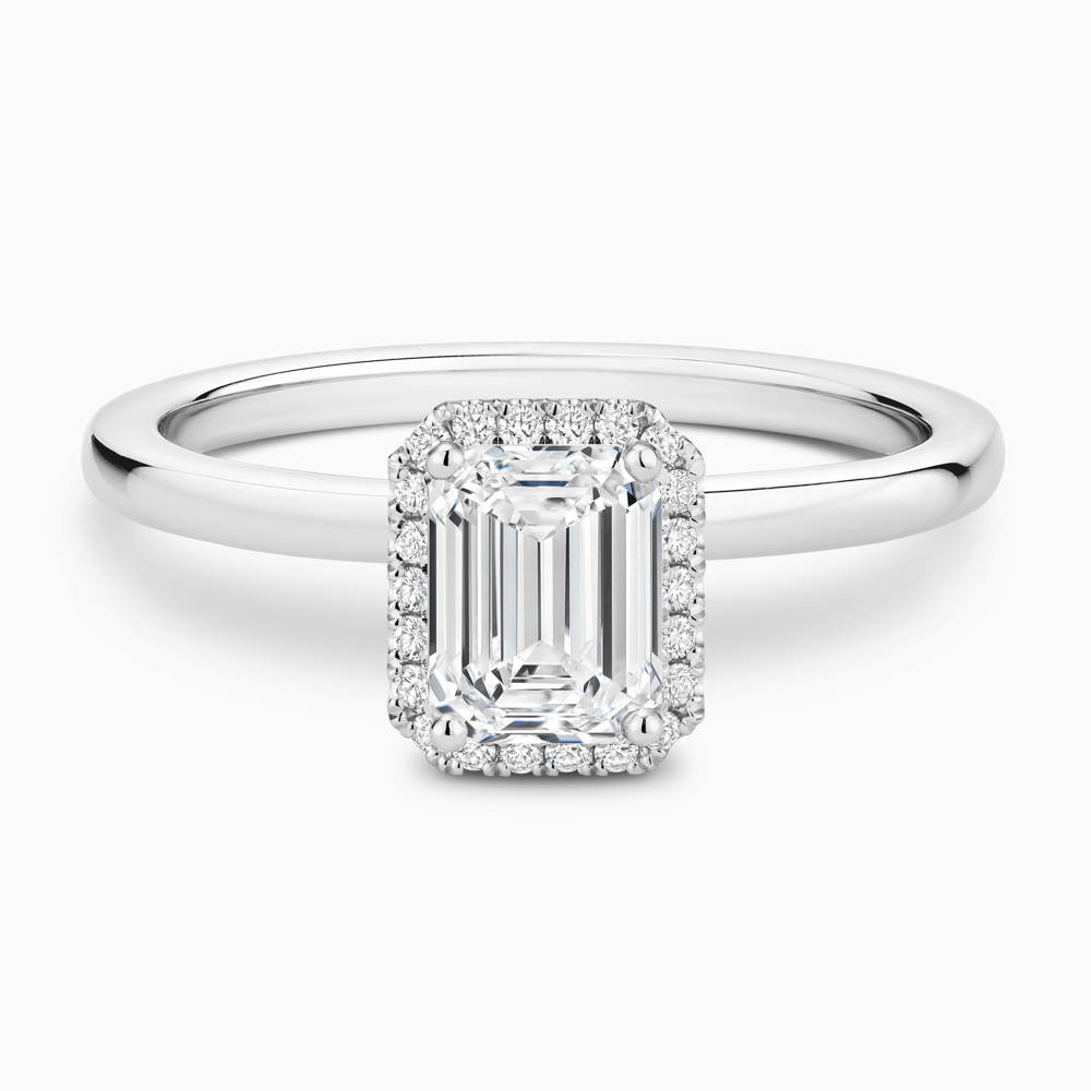 The Ecksand Iconic Diamond Halo Engagement Ring with Plain Band shown with Emerald in Platinum