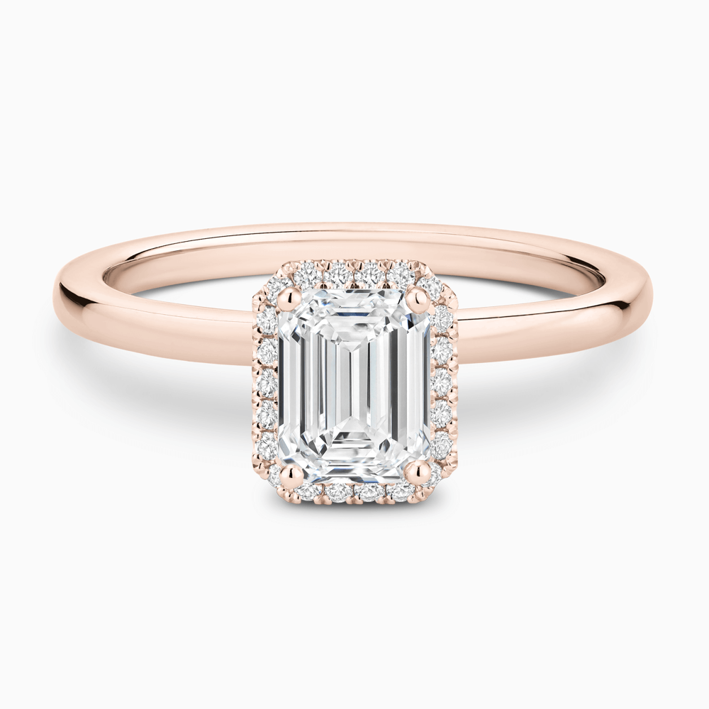 The Ecksand Iconic Diamond Halo Engagement Ring with Plain Band shown with Emerald in 14k Rose Gold