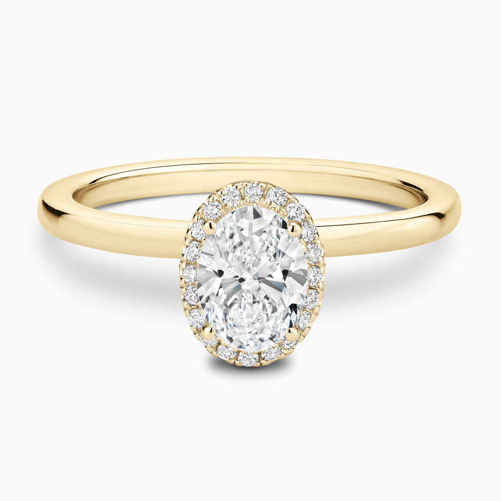 The Ecksand Iconic Diamond Halo Engagement Ring with Plain Band shown with Oval in 18k Yellow Gold