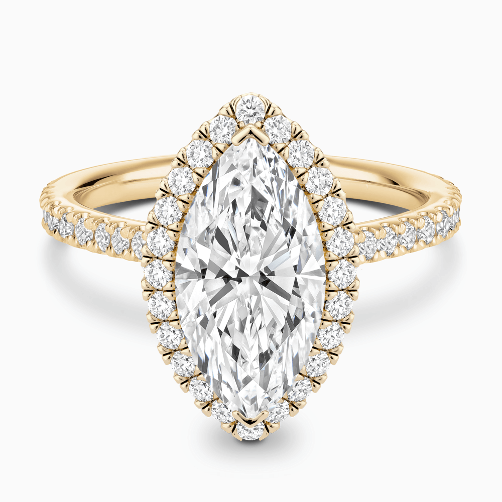 The Ecksand Iconic Diamond Engagement Ring with Halo and Diamond Pavé shown with Marquise in 18k Yellow Gold