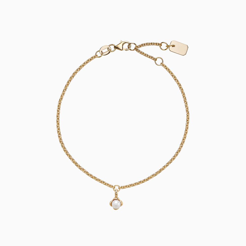 The Ecksand Mini Snowball Charm Freshwater Pearl Bracelet shown with Kid | loops at 4.75", 5.25" and 5.70" in 14k Yellow Gold