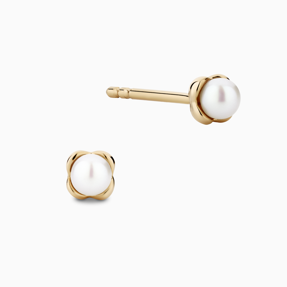 The Ecksand Mini Snowball Freshwater Pearl Earrings shown with Kid | post length 7mm with silicone stopper in 14k Yellow Gold