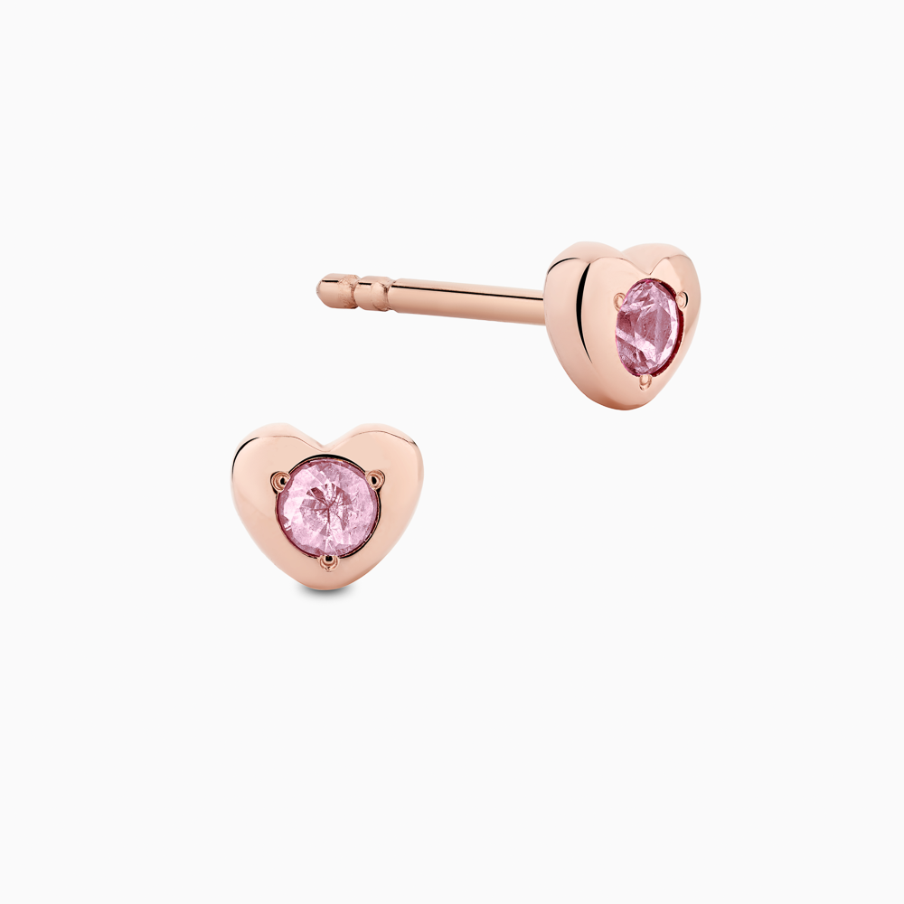 The Ecksand Heart Pink Sapphire Earrings shown with Adult | post length 11mm with butterfly push backs in 14k Rose Gold