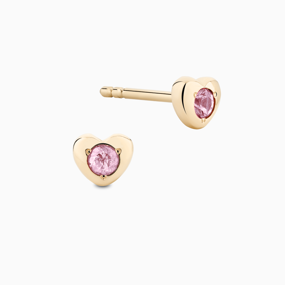 The Ecksand Heart Pink Sapphire Earrings shown with Kid | post length 7mm with silicone stopper in 14k Yellow Gold