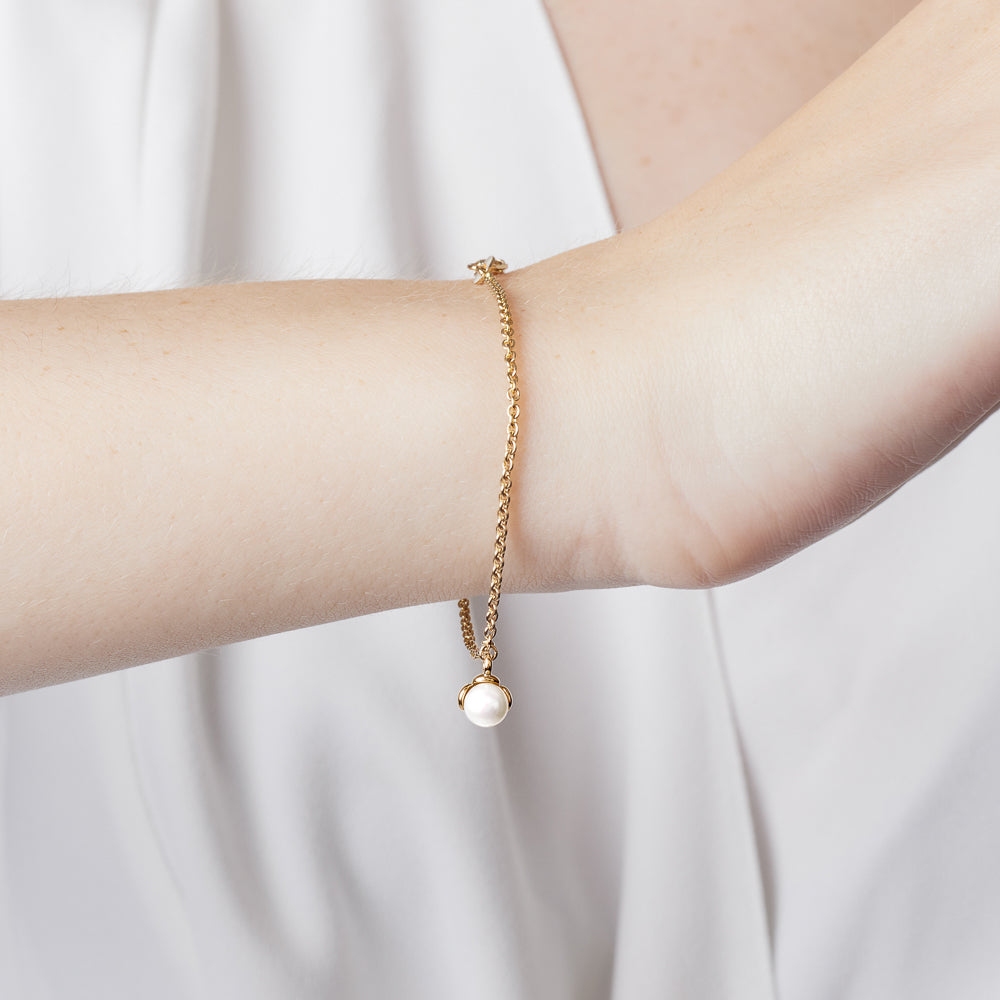 The Ecksand Snowball Charm Freshwater Pearl Bracelet shown with  in 