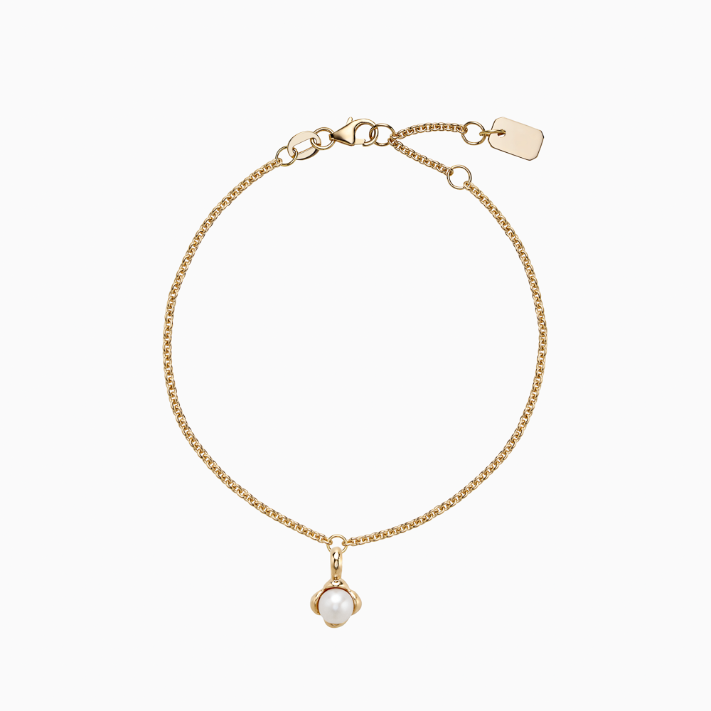 The Ecksand Snowball Charm Freshwater Pearl Bracelet shown with Kid | loops at 4.75", 5.25" and 5.70" in 14k Yellow Gold